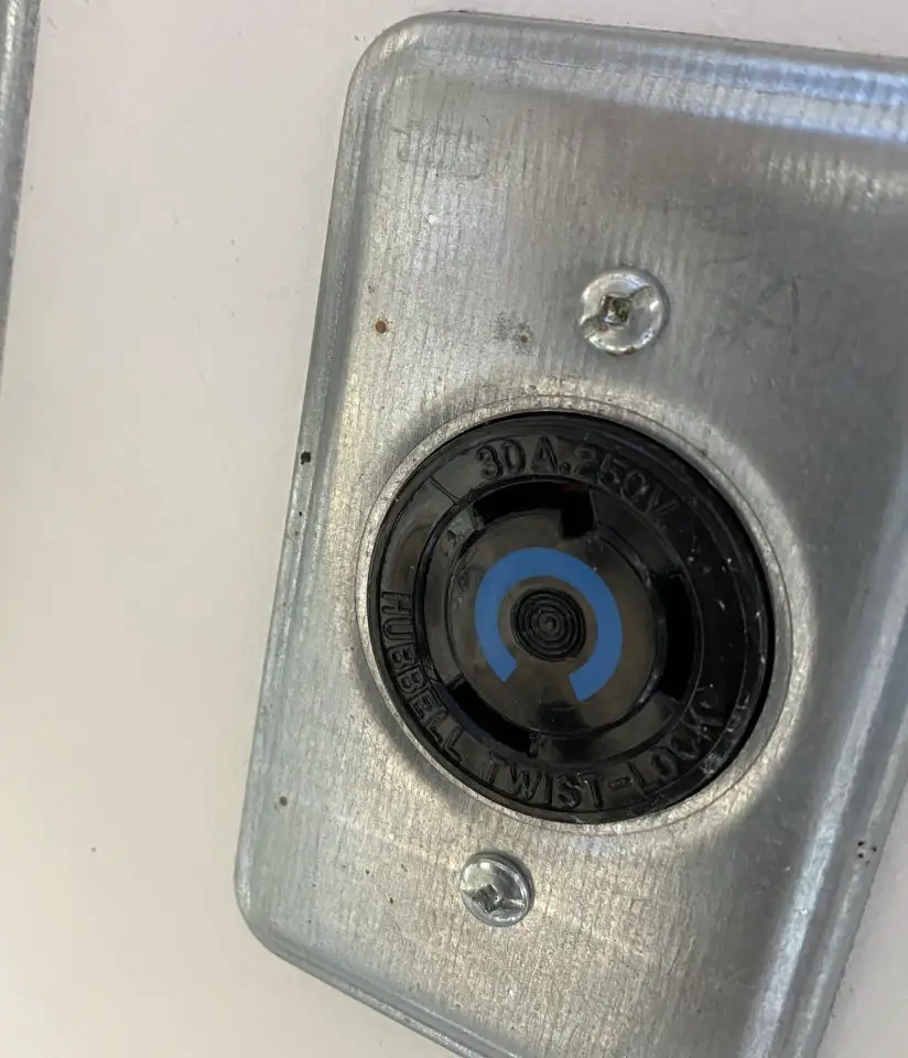 Close-up of Hubbell Twist-Lock electrical outlet.