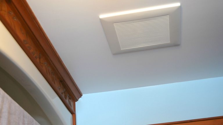 Bathroom ceiling vent with wooden trim