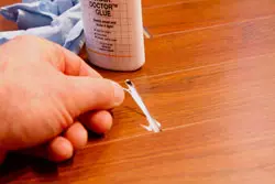 Glue For Laminate Flooring A Simple, How To Stick Down Laminate Flooring