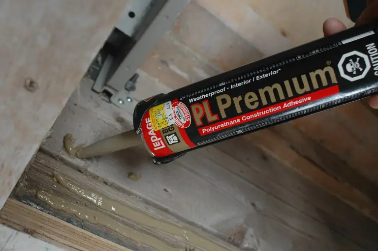 Applying PL Premium adhesive to wood surface
