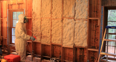 installation of spray foam insulation between wall joists