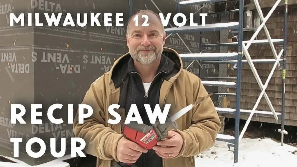 Man holding Milwaukee 12V reciprocating saw outside.