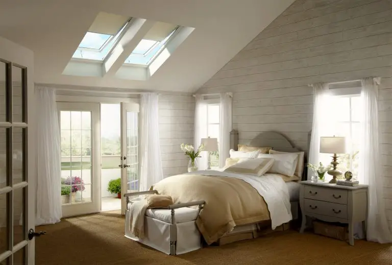 Cozy bedroom with skylights and white decor