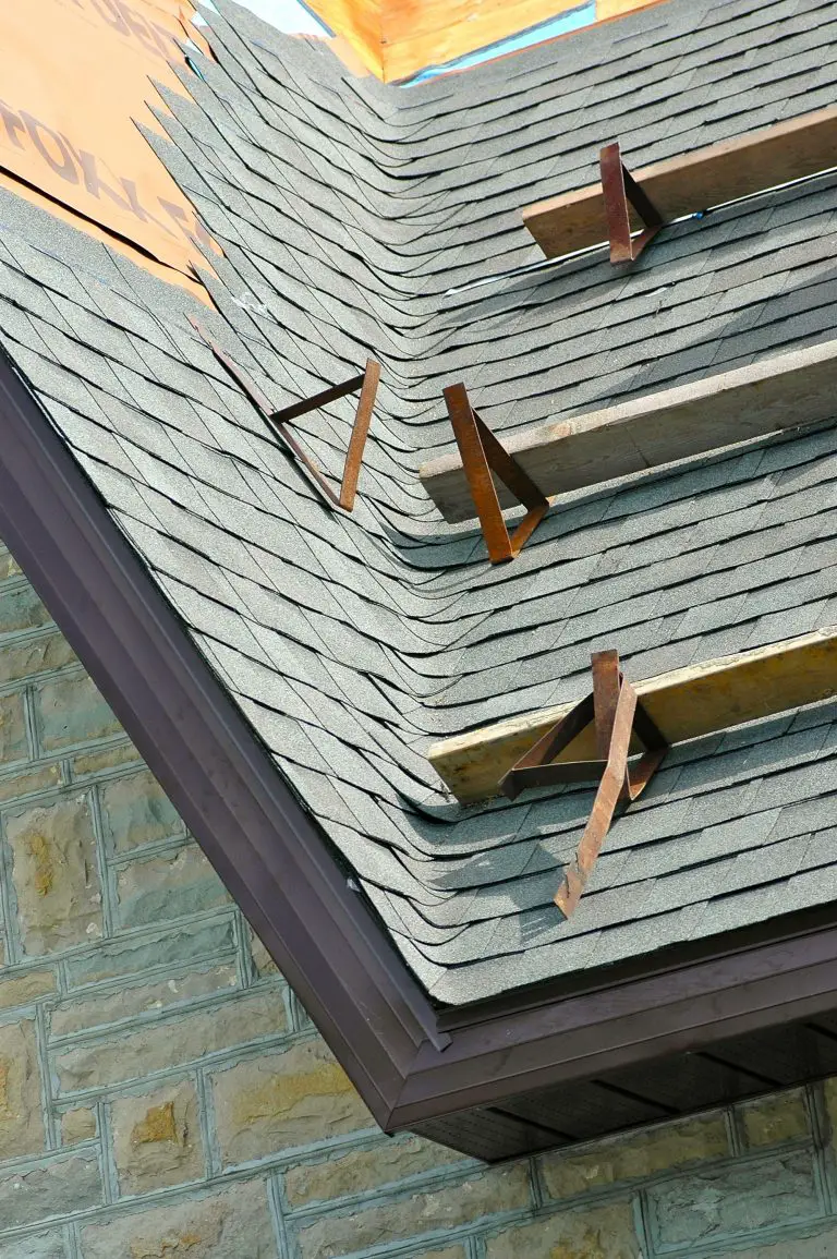 Newly installed asphalt roof shingles on house