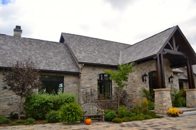 This simulated slate roof is indistinguishable from mineral slate as viewed from the ground. Photo credit: Enviroshake
