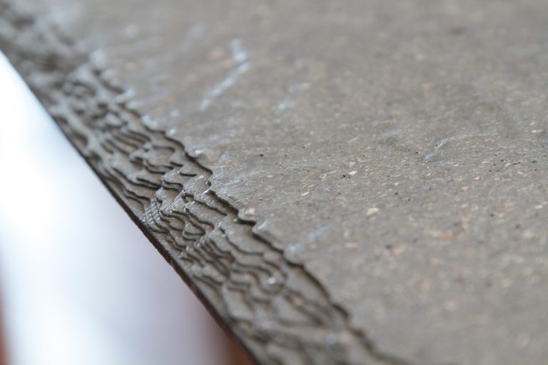 Close-up of textured concrete surface edge.