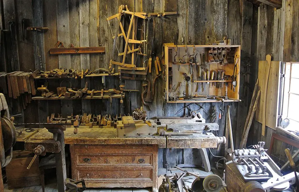 Old woodworking workshop with vintage tools and workbench