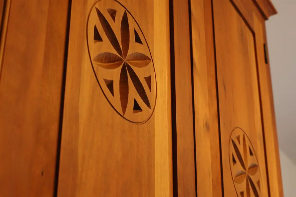 Wooden cabinet door with circular carved design
