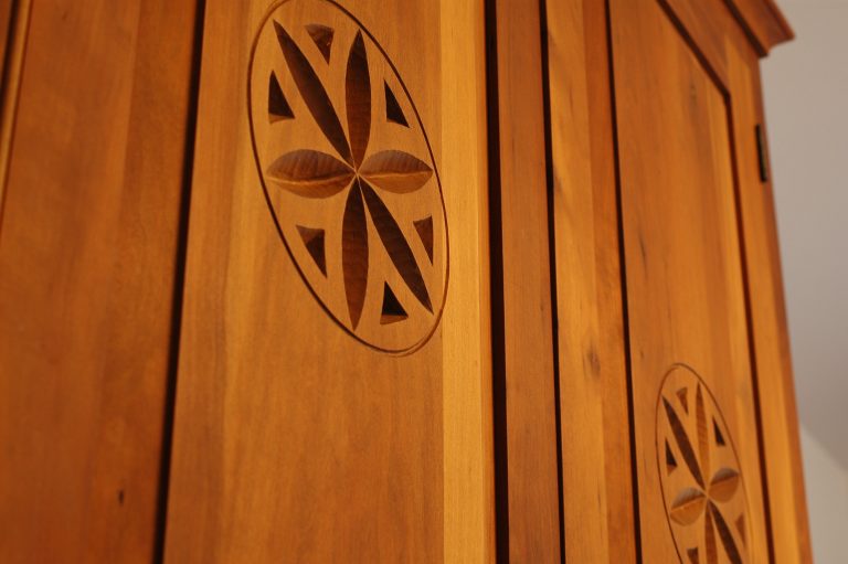 Wooden cabinet door with circular carved design
