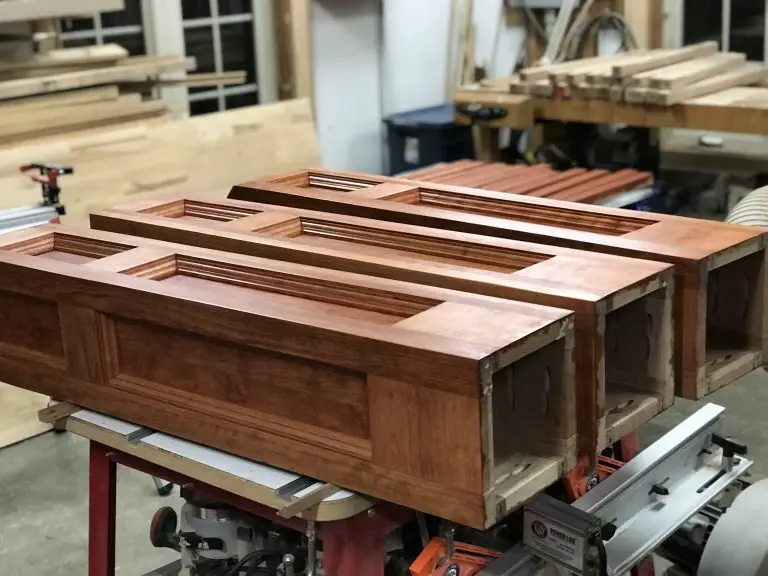 Wooden cabinetry parts in a workshop.