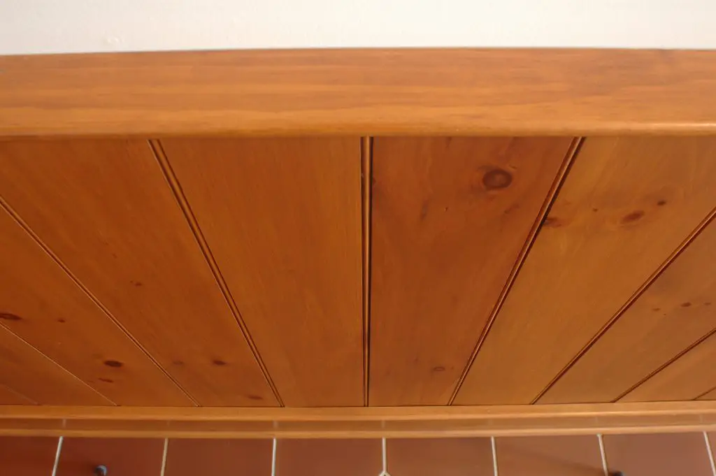 Wooden wall panel with vertical planks.