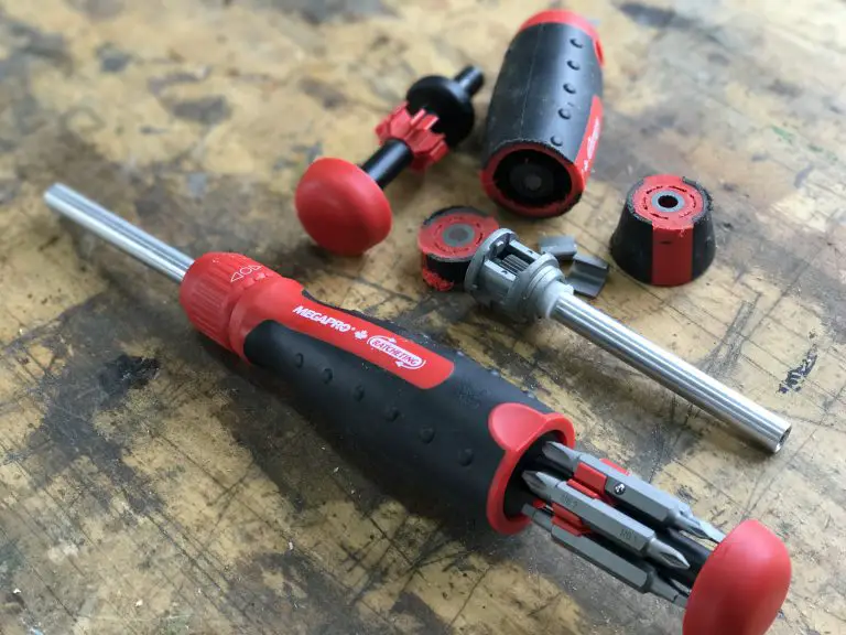 Set of red and black screwdrivers on workbench.