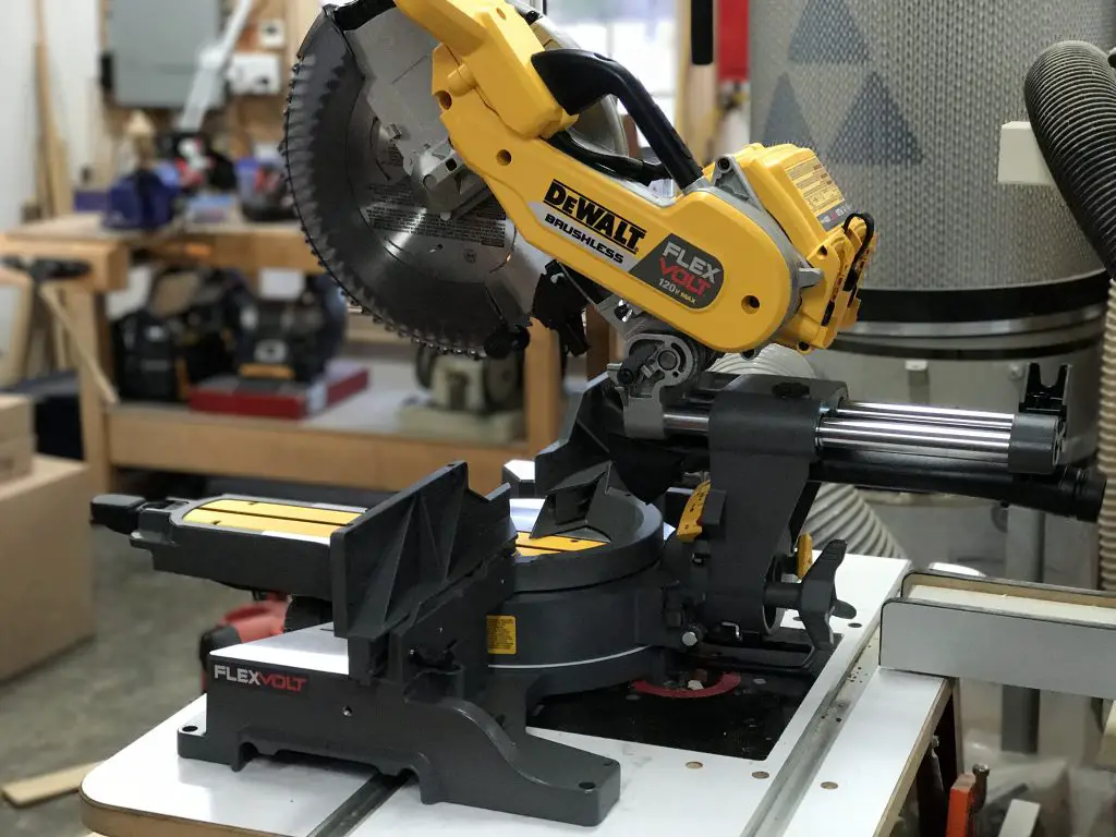 Dewalt FLEXVOLT miter saw on workshop table.