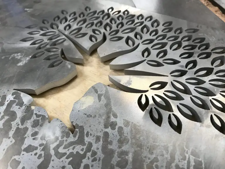 Metal sheet with maple leaf cutout design.