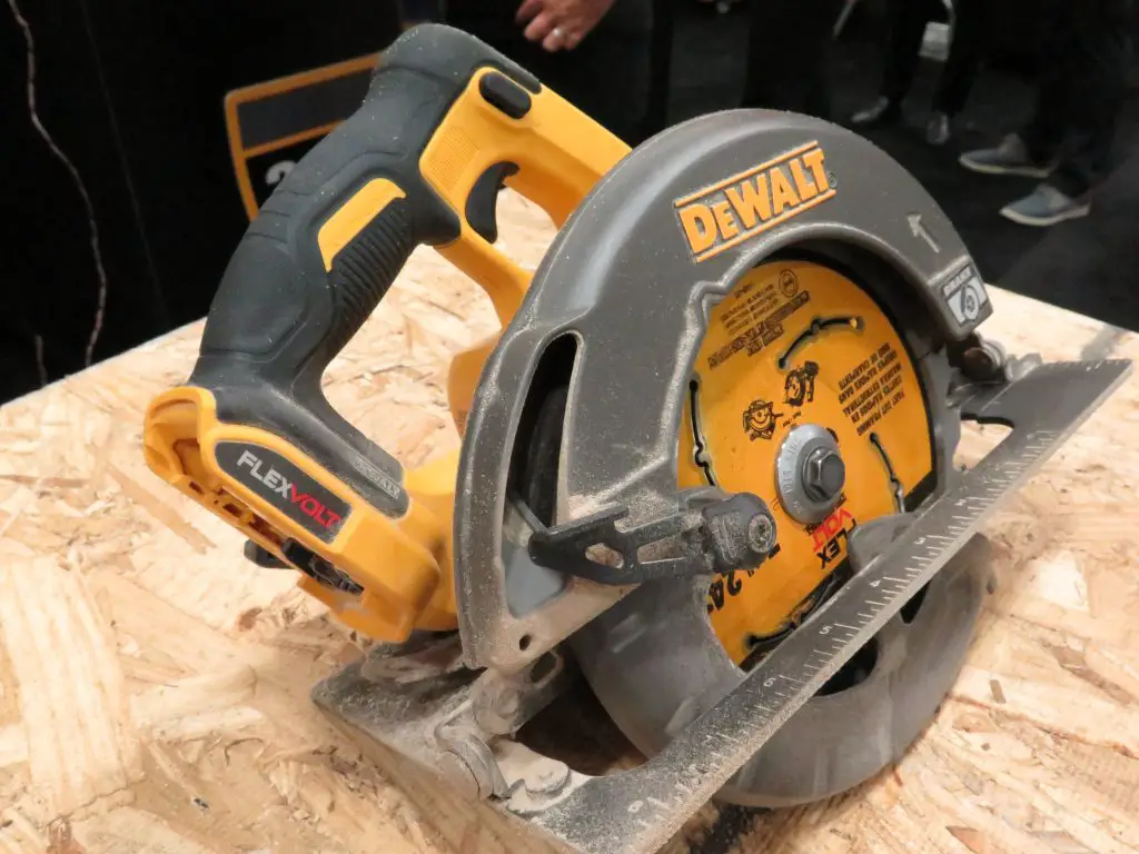 Powerful circular saw on wooden surface.
