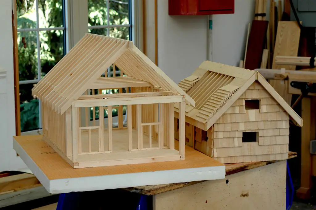 Wooden house models on workshop table