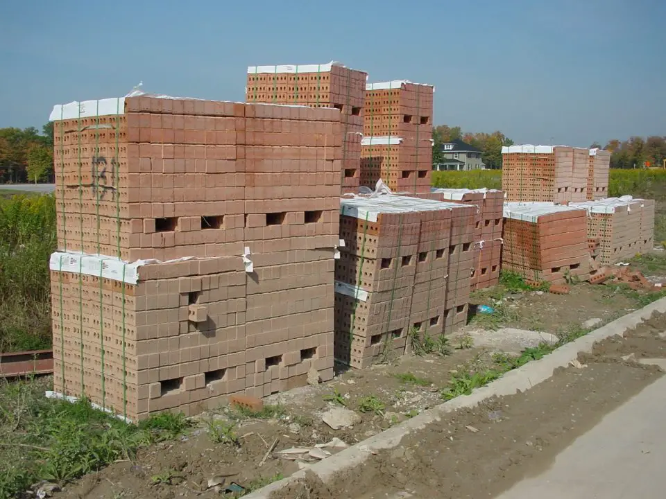 This is the way bricks get delivered on site these days. The open holes through the middle of the pile are for forklift forks.