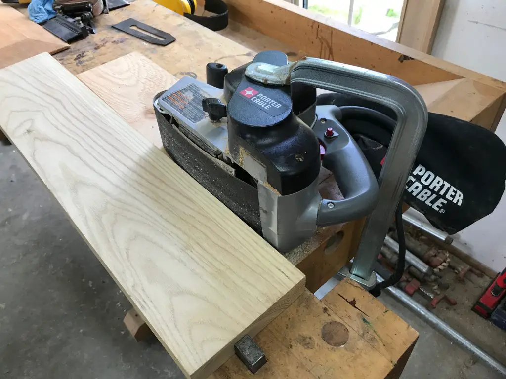Belt sander on workbench