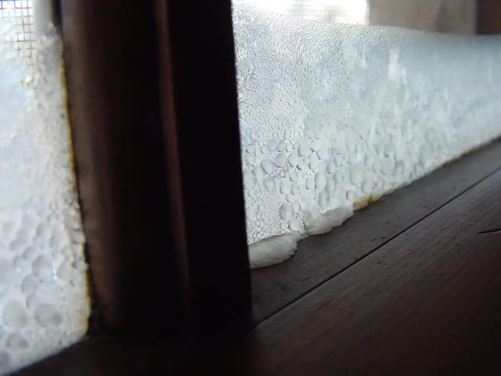 Frost buildup on window during winter
