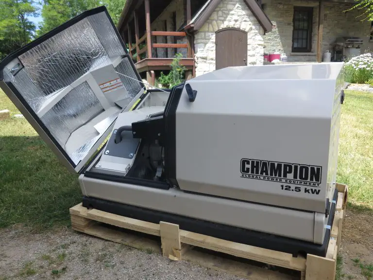 Champion generator with open cover on wooden pallet.