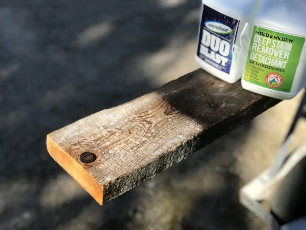 Wood plank with mould remover products on top