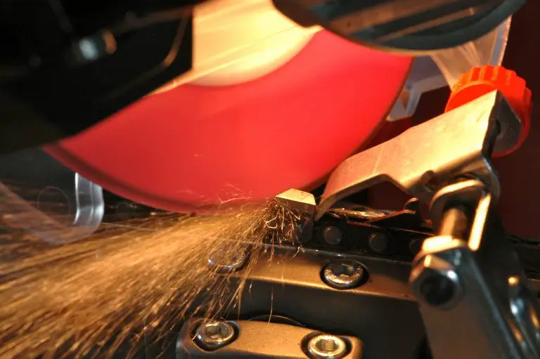 Chainsaw being sharpened with sparks flying