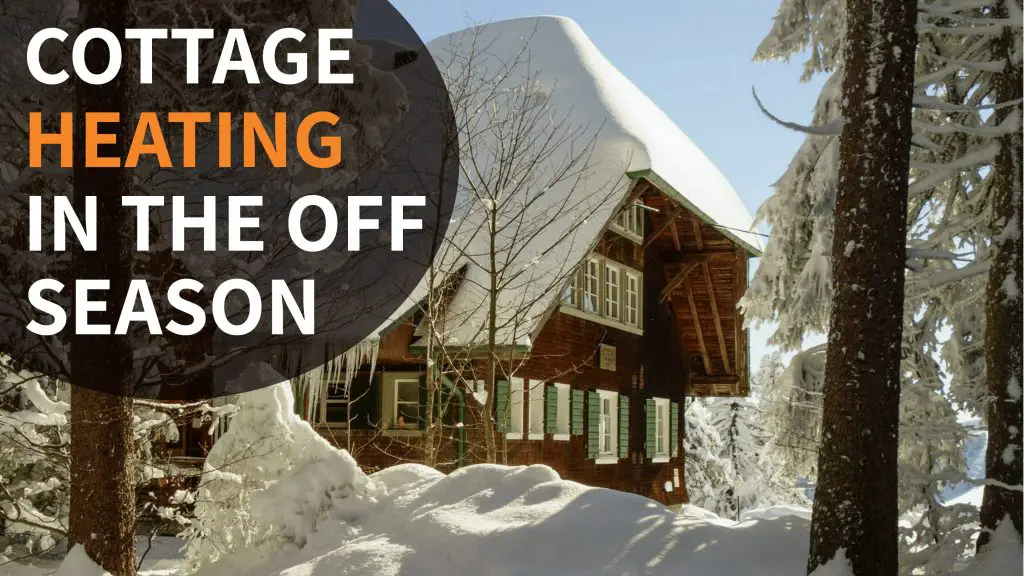 Snow-covered cottage promoting off-season heating solutions.