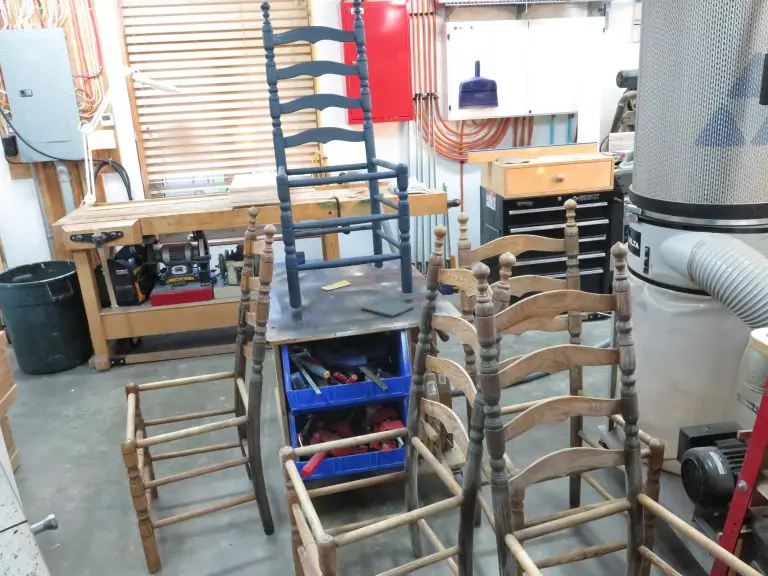 Woodworking shop with chairs and tools.