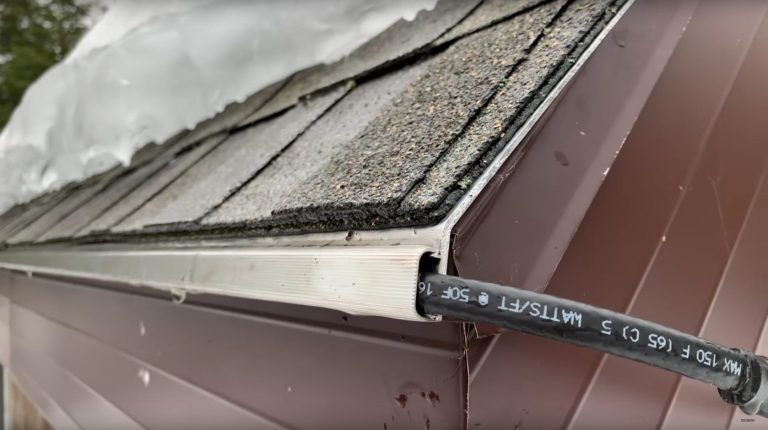 Snow-covered roof with visible black cable