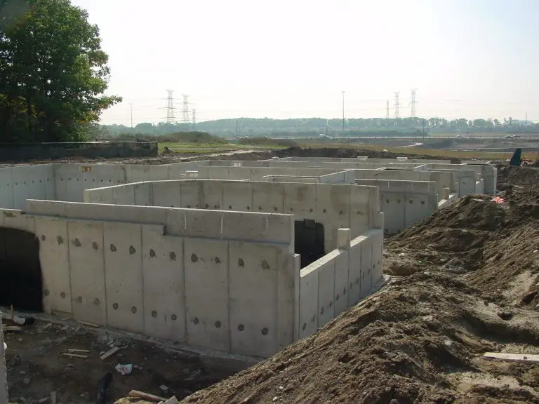 How can I protect the exposed concrete foundation on my new home?