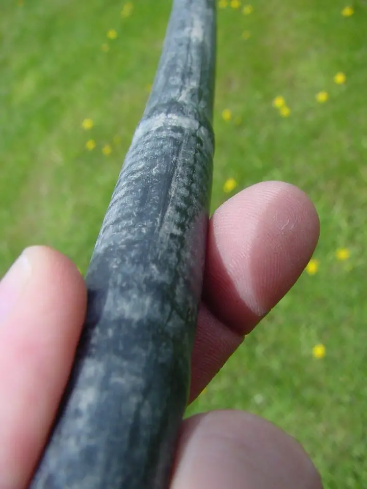 The line I use has an emitter embedded every 18″ inside. The enlarged area here shows where the emitter is.