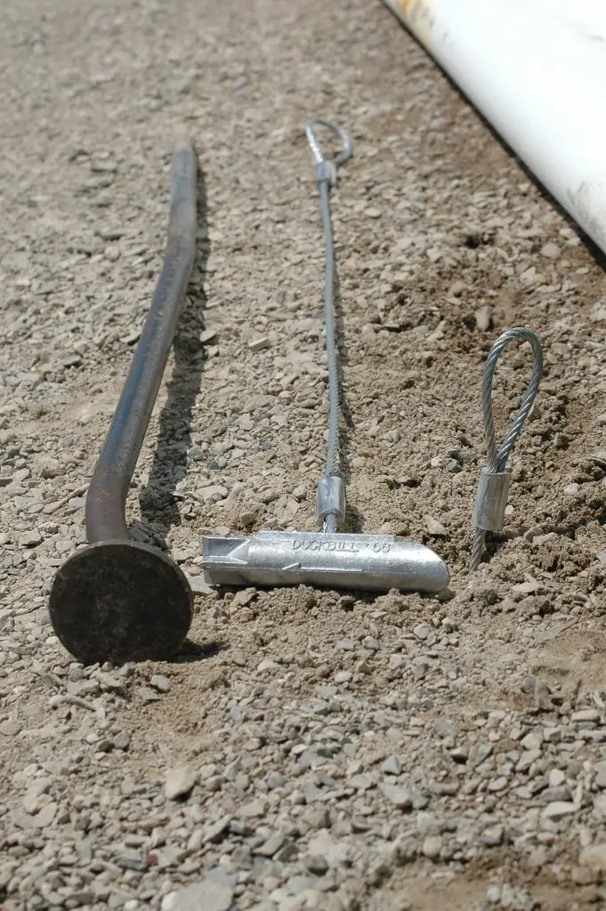 portable garage earth anchor close-up
