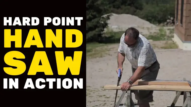 Person using hard point hand saw on wood.