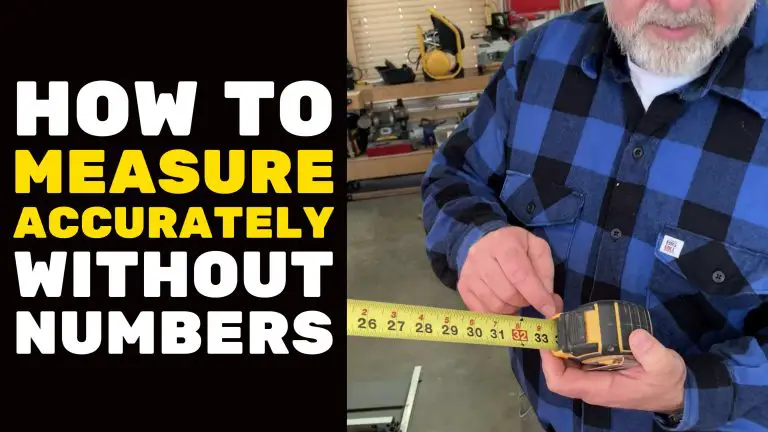 Man measuring with tape in workshop