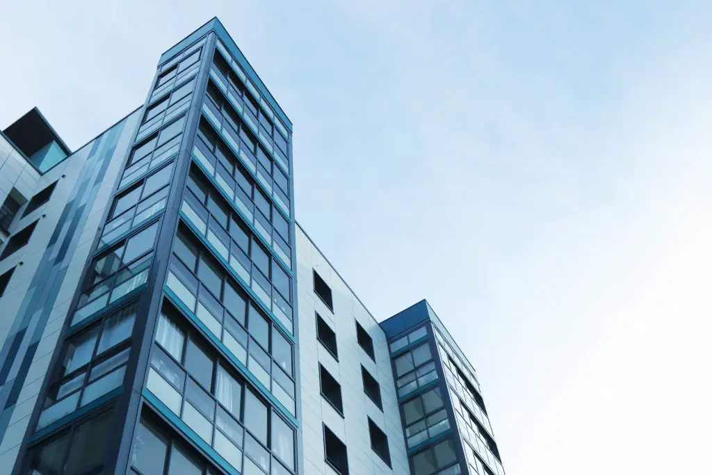 Modern glass building against blue sky