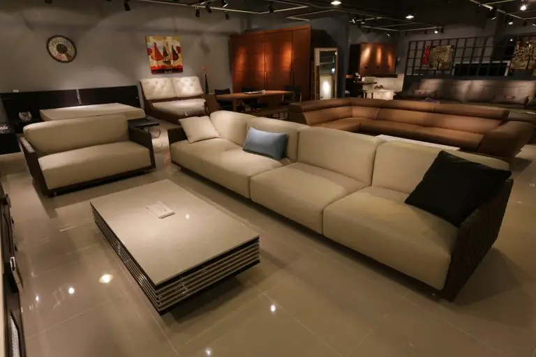 Modern furniture showroom with sofas and tables.