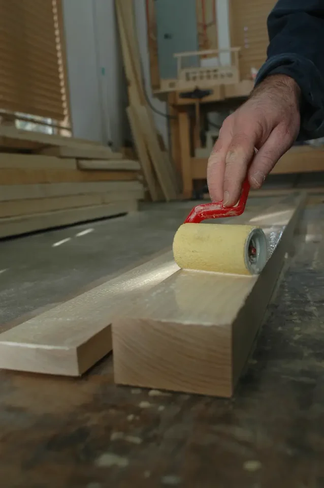 When working with wide laminates, applying glue with a roller is faster, better and more even than just squirting it on from a bottle.