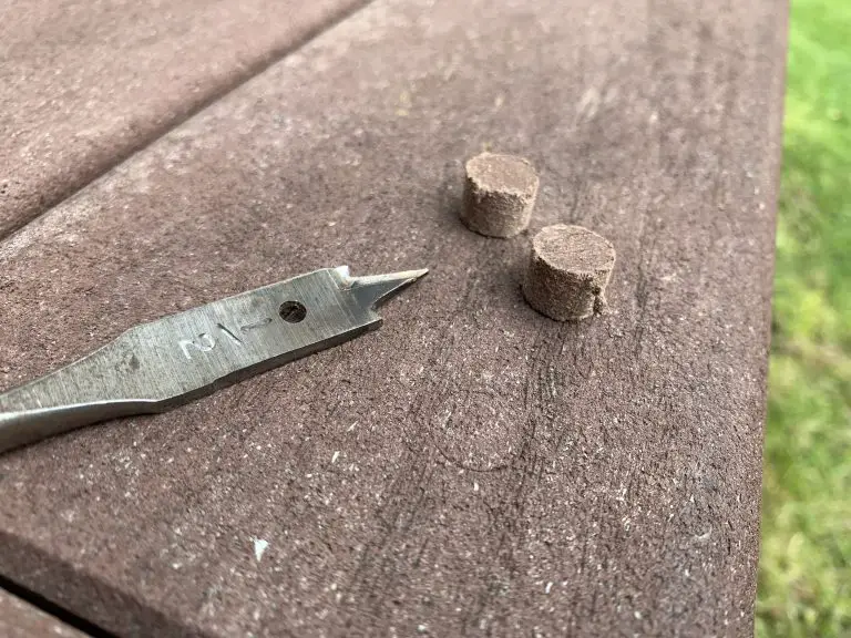 Spade bit and wooden plugs on deck