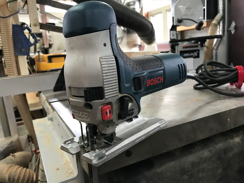 Bosch jigsaw on workshop table saw