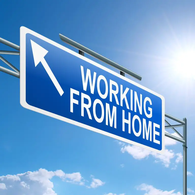 Sign reading 'Working from Home' under blue sky.