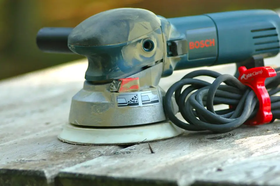 The 6-inch Bosch 1250DEVS is one of the best random orbit sanders for large jobs. It’s much more powerful than 5-inch sanders and it includes variable motor speed and two-position orbital action. Flip the red lever to the left (as shown) and it removes material more quickly than the easier-to-control, reduced orbit position to the right.