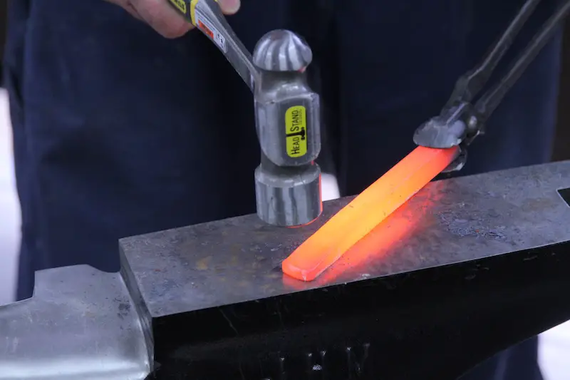 This is what sufficiently heated steel looks like for forging. It will stay hot enough to work for about half a minute.