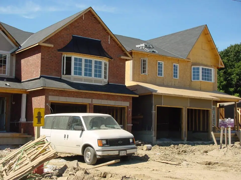 What a difference brick makes. The house on the left has the same wood frame as the place on the right, but of course the brick looks so much better (and lasts forever, too).