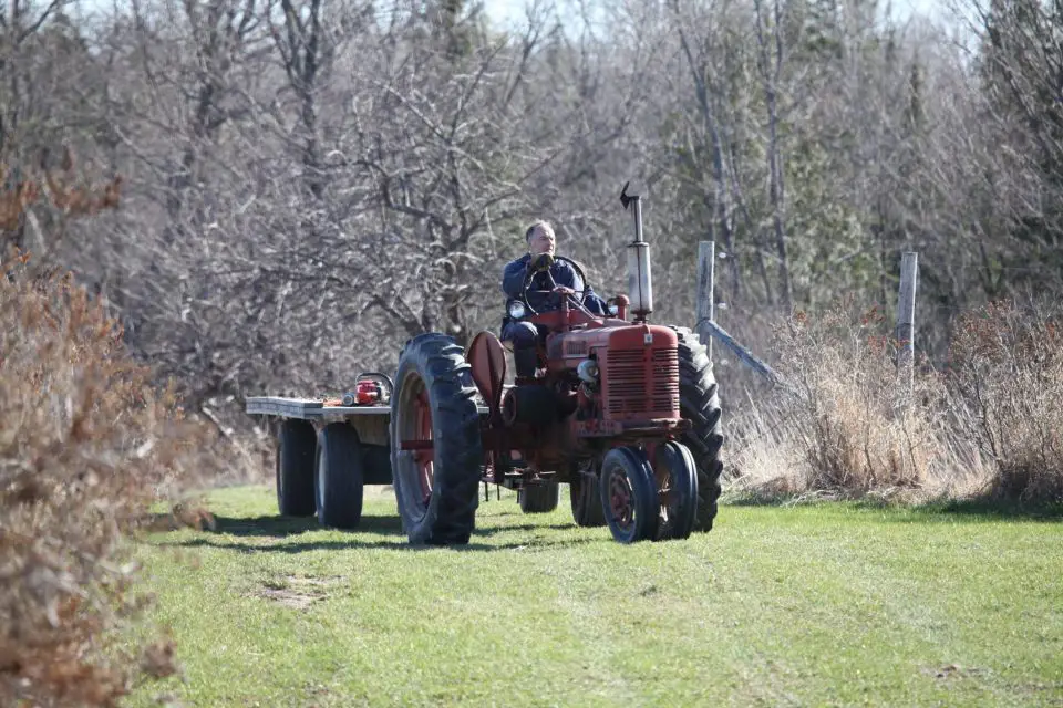 This is me on my 1953 Farmall Super H tractor. With no special care required, this reliable old machine just keeps on pulling.