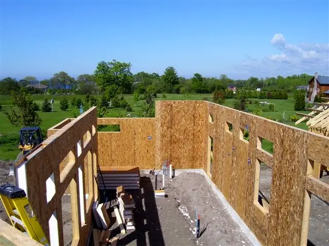 These walls are made of structural insulated panels (SIPs) and perform roughly twice as efficiently as conventional stud frame walls, they go up faster and they’re about 300% stronger than framed equivalents.