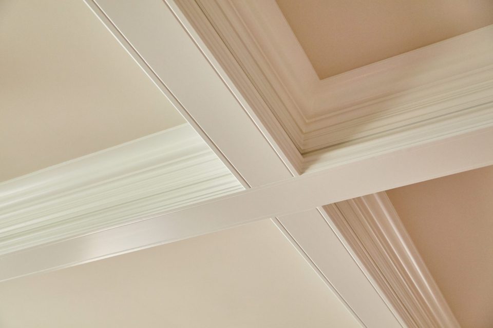 The taller the ceiling, the wider the crown you should use. This coffered ceiling is an example of crown molding playing a powerful visual role in a room.