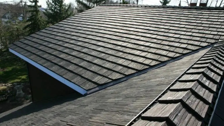 Wooden shingle roof with surrounding trees.