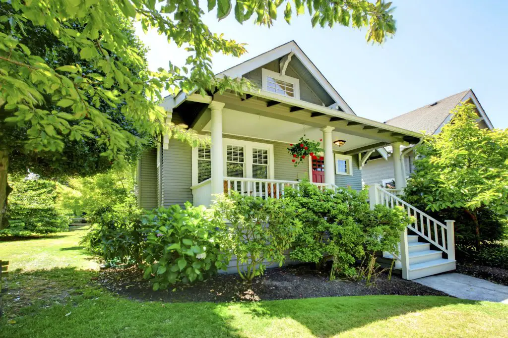 Charming house with porch and green garden