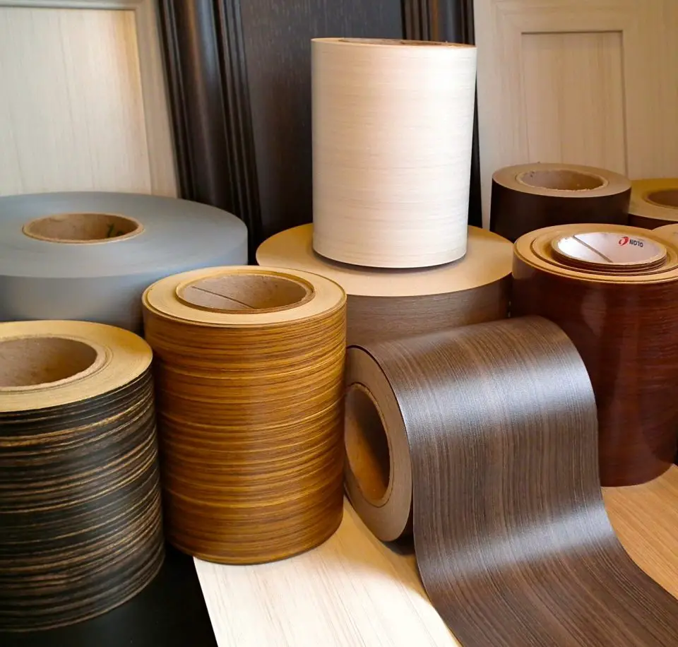 This is the basis of wrapped profiles. These flexible wood grain materials can be applied to flat or curved shapes in factories.
