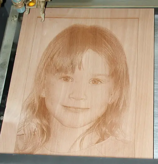 A man named Fred Glover introduced me to laser engraving in 2001. This photograph of one of his daughters is burned into a piece of alder wood.